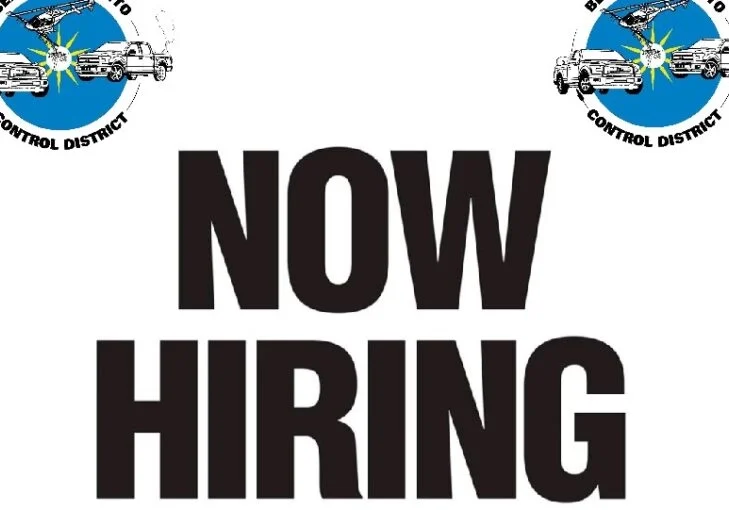 Sign with "Now Hiring" text and logos of Benton County Mosquito Control District, highlighting mosquito control measures alongside images of mosquitoes and trucks.